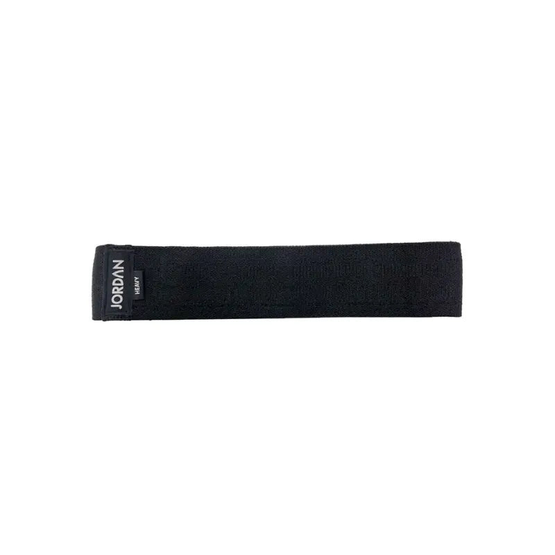 The JORDAN Fabric Resistance Band is a non-slip booty band for squats, lunges, and glute workouts. Shown in red with a black Jordan Medium label against a white background.