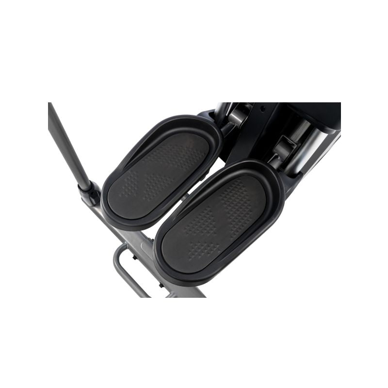 Black footrest attached to an elliptical trainer  on a white background