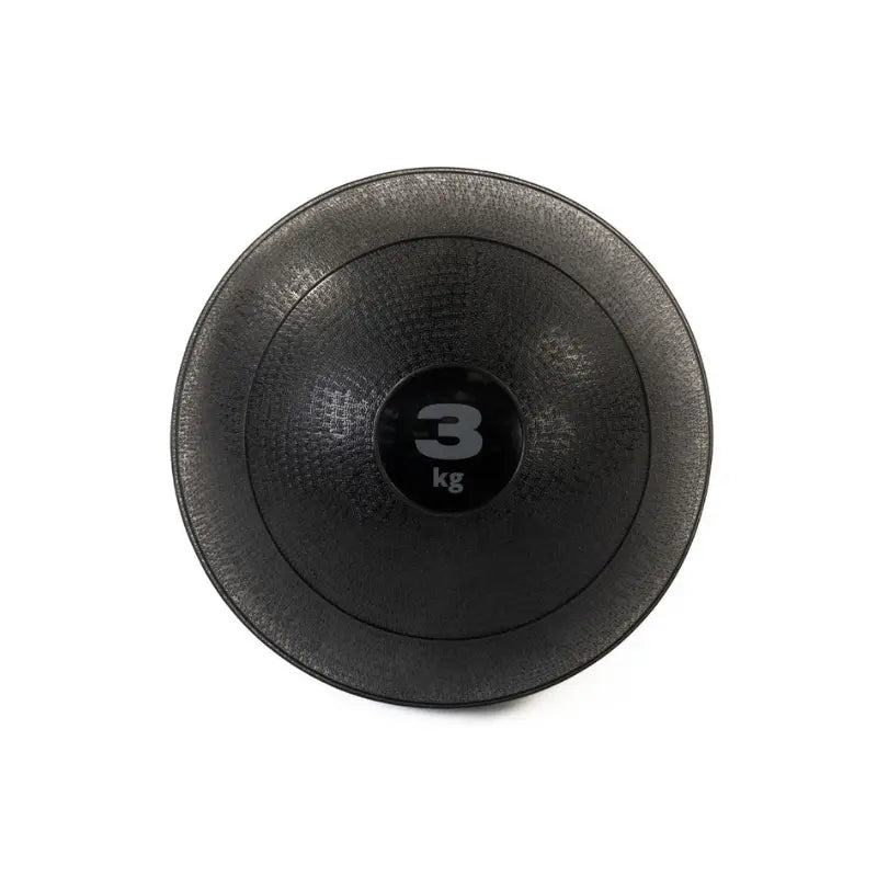 The Attack Fitness Slam Ball, a black textured 3 kg non-bounce weighted ball for functional power and conditioning, is shown from above with 3 kg printed in white at the center against a white background.