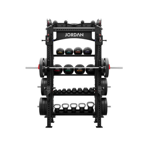 The JORDAN -J75 Cable Rack in black is a versatile gym power rack with barbells and weight plates on both sides. It features storage for weights and equipment, making it ideal for strength training exercises. The top arch is labeled Jordan.