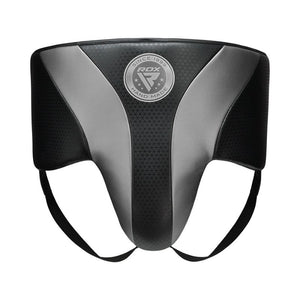 A black and gray protective groin guard with the "RDX" logo in the center, featuring two leg straps and designed for sports or martial arts use.
