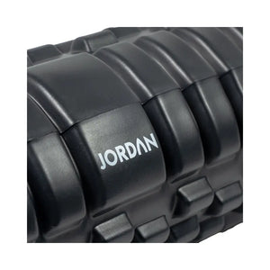 The Jordan Medium-Density Massage Roller – Everyday Foam Roller features a textured black, grid-like surface with Jordan printed in white, perfect for daily recovery and muscle relief. Pictured horizontally on a white background.
