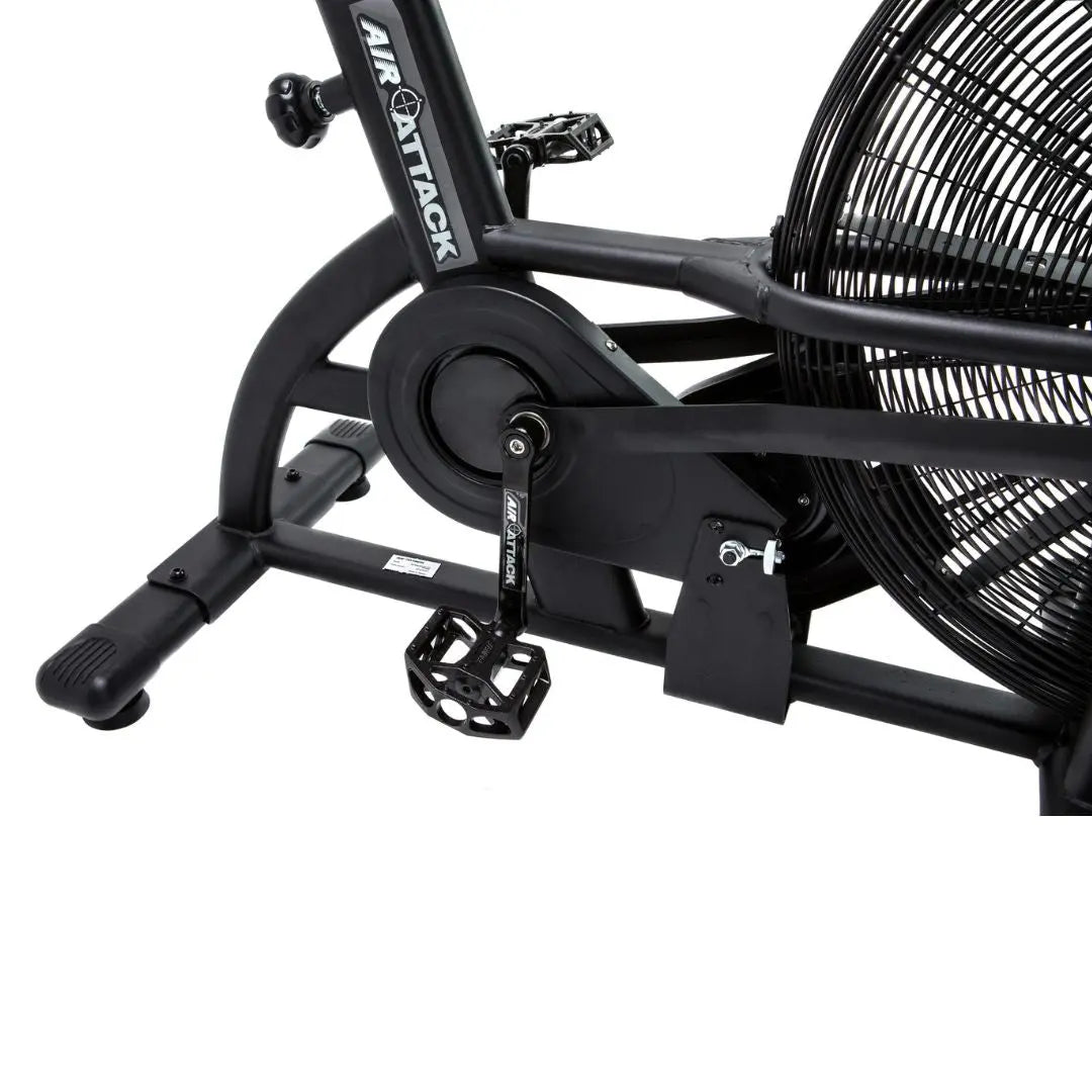 The Attack Fitness Air Attack Bike is a commercial air resistance cardio machine featuring a large fan wheel, upright handles, pedals, and an adjustable seat for intense full-body indoor workouts.