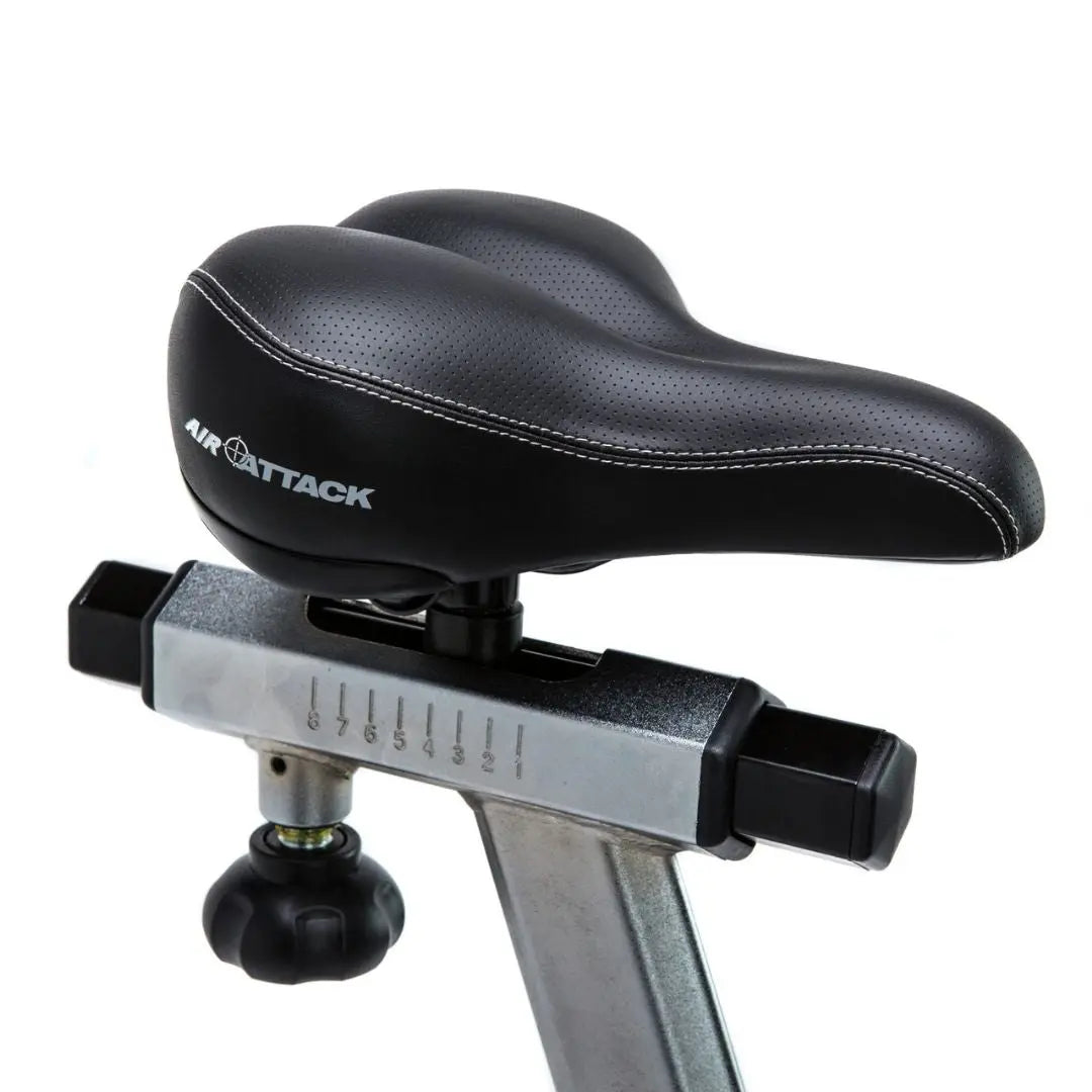 The Attack Fitness Air Attack Bike is a commercial air resistance cardio machine featuring a large fan wheel, upright handles, pedals, and an adjustable seat for intense full-body indoor workouts.
