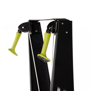 The ATTACK FITNESS Ski Attack is a sleek black ski trainer with green-accented handles, designed for a full-body workout. It features two vertical poles, handles, and a digital display. The sturdy base includes a fan mechanism for resistance, perfect for Nordic skiing enthusiasts.