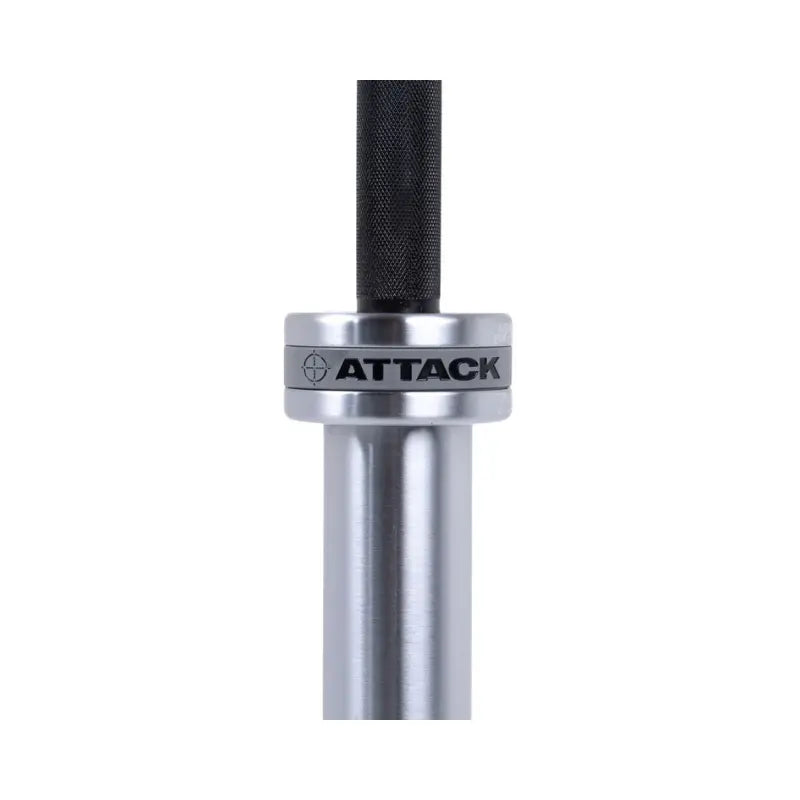 A close-up of the Attack Fitness Olympic 7ft Bar’s end cap shows “20” and Tactical/Strike text around a crosshair. The Cerakote Black finish is visible as the bar, 1500lb tested, angles away on a white background.