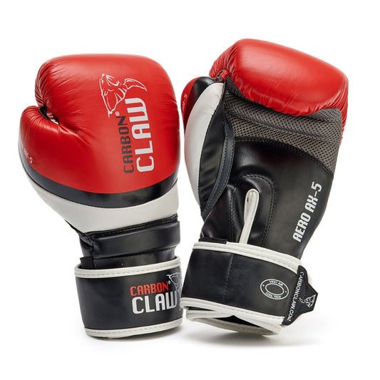 A red, black, and white pair of CARBON CLAW - AERO AX5 Spar Training Glove by Carbon Claw; one glove stands upright showcasing its premium sparring logo while the other is slightly tilted to reveal its design for exceptional boxing performance.