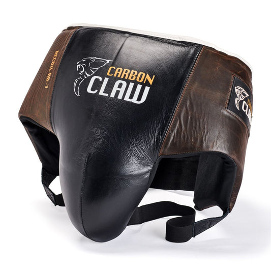 The CARBON CLAW - RECOIL RB-7 Series Groin Guard is a leather boxing guard with a large protective cup in black, brown, and white. It features sturdy adjustable straps and prominently displays the Carbon Claw branding on the surface.
