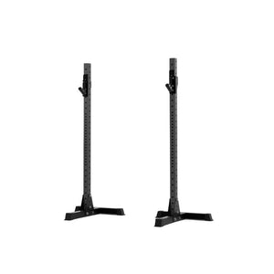 The Exigo X70 Free Standing Squat Stands by Exigo, in black with wide stable bases, are perfect for heavy barbell training and ideal for any home gym setup. Shown side by side on a white background.