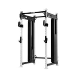 The Exigo EXIGO X70 Cable Power Rack, a black and white commercial training station with adjustable hooks and pulleys for weightlifting, stands against a white background.