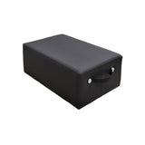 The HEGREN TALMA Pilates Box by Hegren is a premium high-density rectangular reformer box in black with a smooth surface, fabric handle, and two metal rivets, shown against a plain white background.