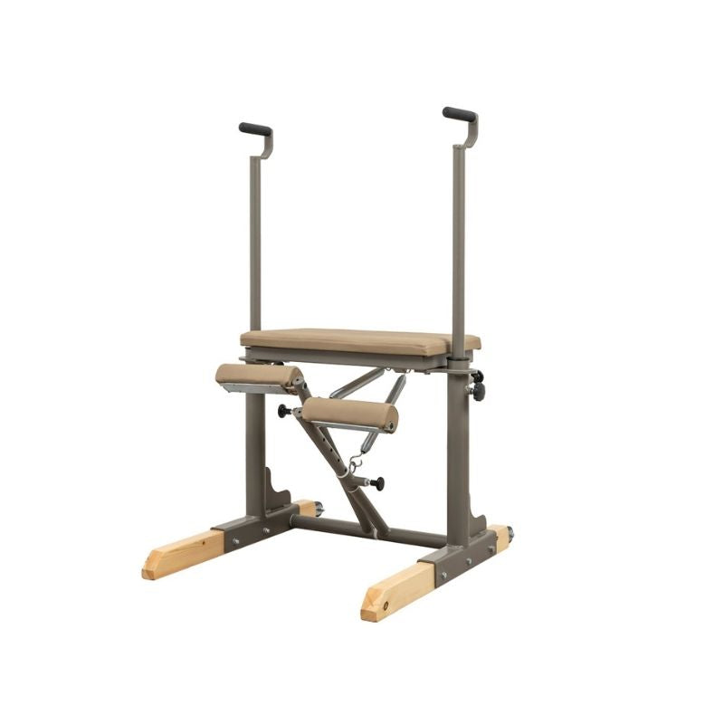 The HEGREN TALMA 62CH Pilates Chair by Hegren features a padded beige seat, metal frame, wooden footrests, and adjustable arm handles—ideal for exercise and strength training with studio-grade stability.