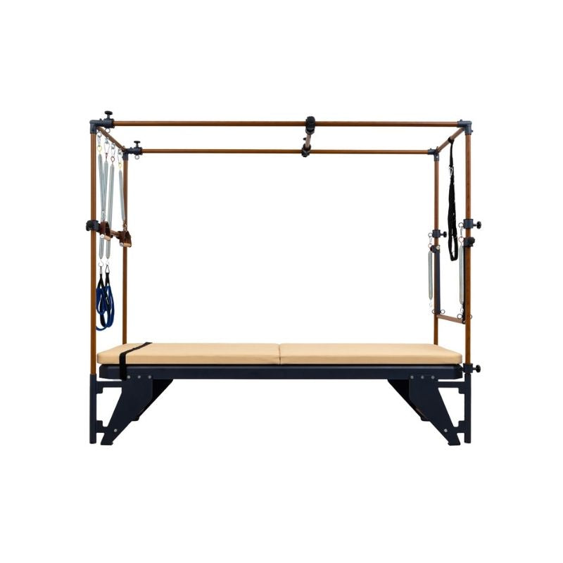 The Hegren HEGREN TALMA TRC Cadillac Trapeze – Full Professional Pilates Tower System features a metal frame, beige padded bed, wooden bars, and multiple straps/handles—ideal versatile rehabilitation equipment viewed from the front.