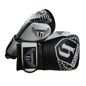 The sleek HATTON BOXING Boxing Gloves PU in black and white, featuring the Hatton brand and a winged logo, are shown overlapping against a white background.