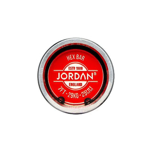 Circular end of the Jordan Hex Bar – 6ft & 7ft Olympic Trap Bar with a red label reading JORDAN ENGLAND, ESTD 1989, 7FT - 29KG - 25MM, HEX BAR—an Olympic bar from Jordan for serious training.