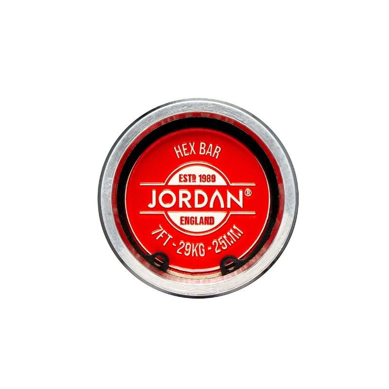 Circular end of the Jordan Hex Bar – 6ft & 7ft Olympic Trap Bar with a red label reading JORDAN ENGLAND, ESTD 1989, 7FT - 29KG - 25MM, HEX BAR—an Olympic bar from Jordan for serious training.