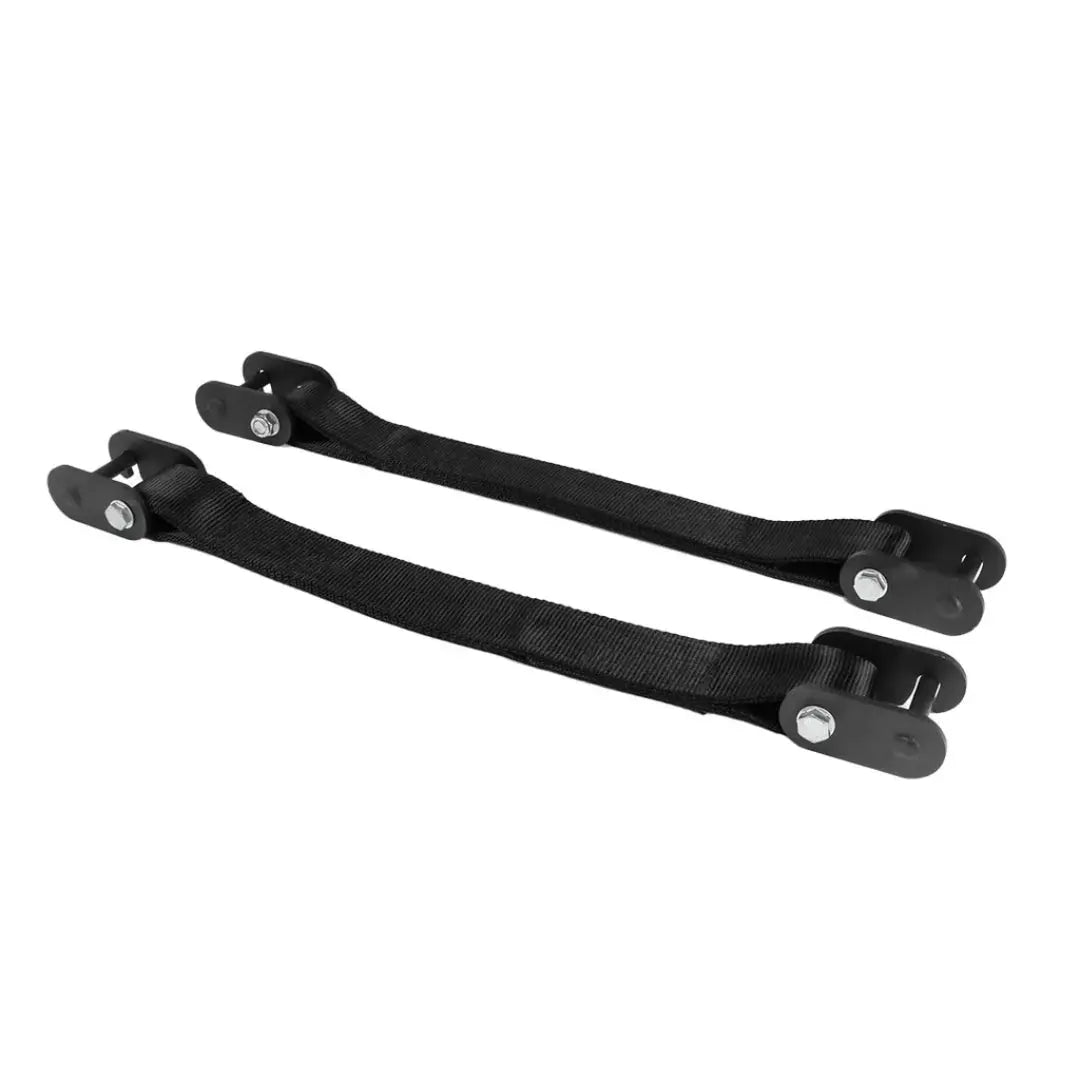 A pair of Jordan HELIX Safety Strap System Attachments, featuring black hinge straps with metal bolts and fasteners, laid parallel on a white background. Crafted from durable material, theyre perfect for home gym use to ensure tightly secured objects.