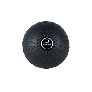 A black textured JORDAN High-Performance Slam Ball by Jordan, viewed from above, features grooves for grip and a central logo. Its rugged surface is perfect for strength training and high-intensity workouts.