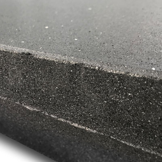 Close-up of the MYO Strength High Density Rubber Floor Tile (1000mm x 1000mm x 40mm) by MYO Strength, featuring a thick, dark gray, slightly textured impact-resistant mat with a rough, grainy non-slip surface and visible layers.