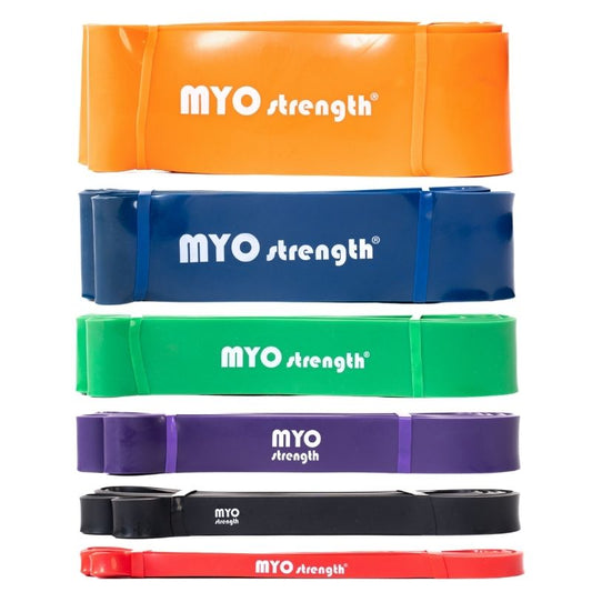 Six MYO Strength - Resistance Bands by MYO Strength in orange, blue, green, purple, black, and red are neatly coiled on a white background. Made from seamless latex rubber, theyre ideal for strength training routines.