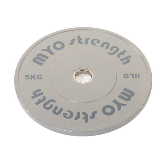 A gray MYO Strength Bumper Plate - Rubber - Coloured by MYO Strength, marked 5 KG/11 LB with IWF standard dimensions and a central hole for Olympic lifting.