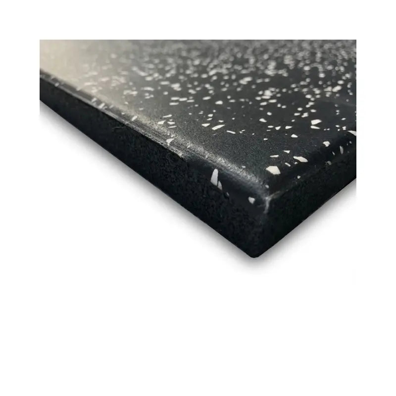 Close-up of the MYO Strength Rubber Gym Flooring Tile in black with white speckle (1000x500mm), highlighting its shock-absorbing thickness and beveled edge—ideal for commercial gyms—by MYO Strength.