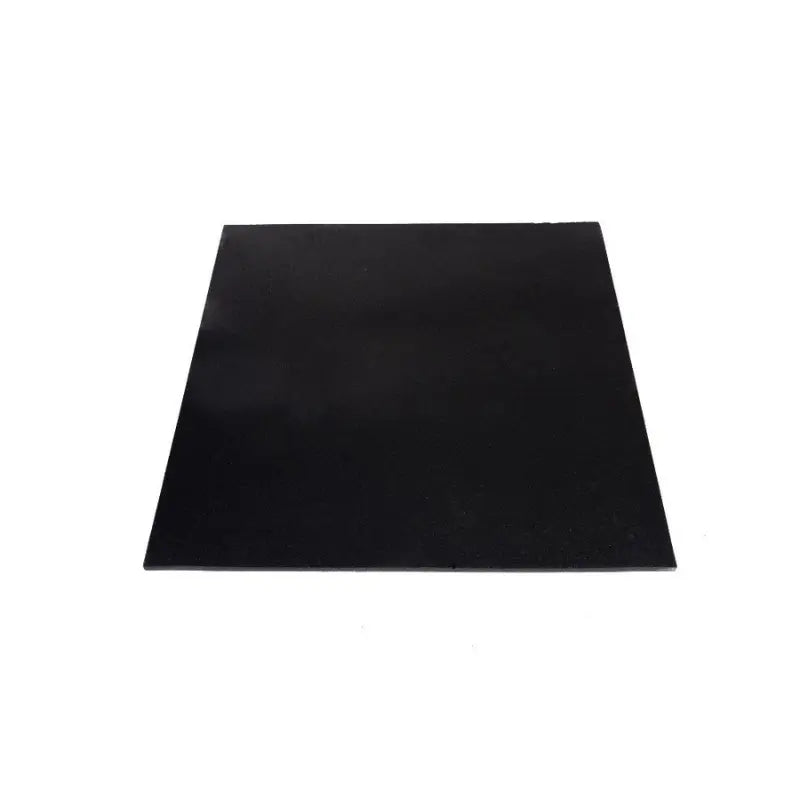 Close-up of two overlapping MYO Strength Rubber Gym Flooring Tiles in black (1000x1000x20mm) with textured, slightly shiny surfaces and square edges—ideal for impact protection. Brand: MYO Strength.