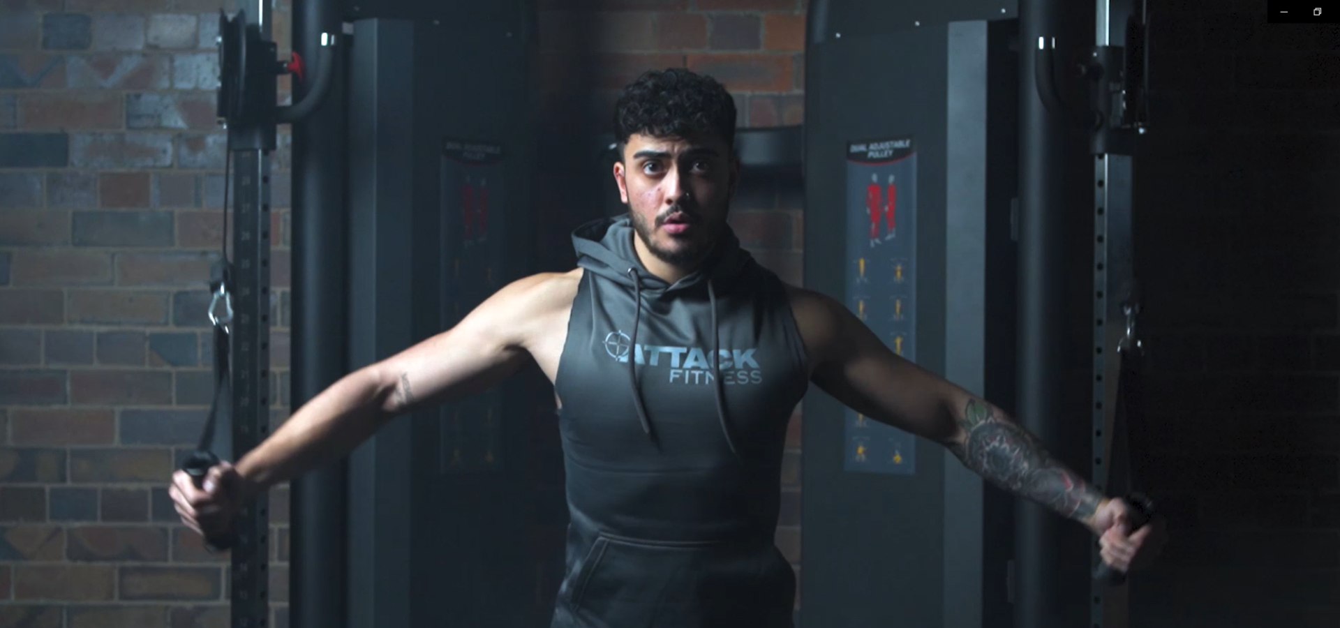 Man exercising with resistance bands in a gym setting
