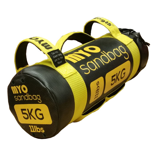 A yellow and black MYO Strength Sandbag with two handles, labeled 5KG/11lbs. This cylindrical MYO Strength product is built for functional fitness and strength training, ensuring durability and versatile performance.