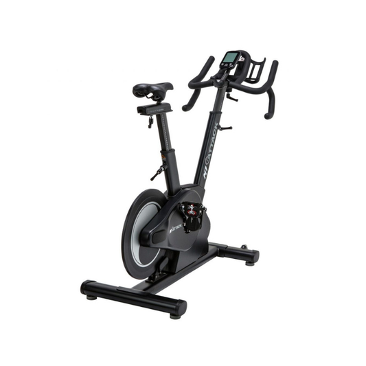 The Attack Fitness M1 Magnetic Studio Bike by Attack Fitness is a black belt-driven indoor cycle with console, featuring an adjustable seat, handlebars, and large flywheel—ideal for indoor cycling workouts against a white background.