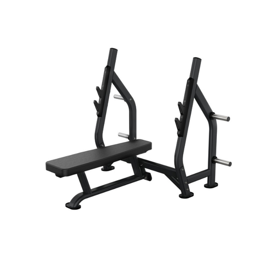 The Attack Fitness Attack Strength Olympic Flat Bench is a heavy-duty flat bench press with an attached barbell rack, multiple bar hooks, and side plate storage pegs. Product shown on a white background.