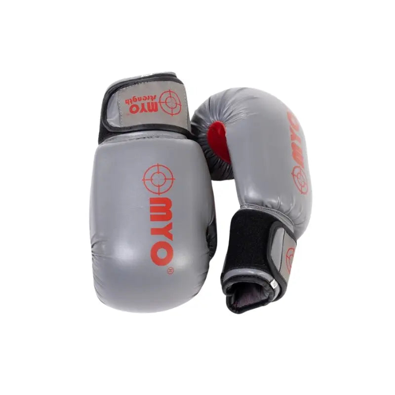 The MYO Strength PU Boxing Gloves – Grey/Red feature black straps, red target logo, and red lining for optimal wrist support during training or sparring. Available in 12oz, 14oz, and 16oz.