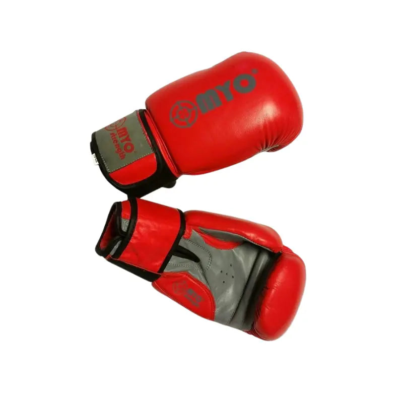 MYO Strength Leather Boxing Gloves in red/grey (12oz, 14oz, 16oz), featuring black wrist straps for extra support, are shown on a white background.