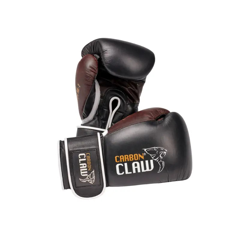 The CARBON CLAW – RECOIL RB-7 Spar Training Gloves, by Carbon Claw, feature a black and brown leather design with claw logo—durable and ideal for intense sparring sessions. Shown against a white background.