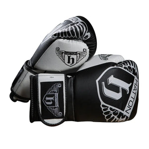 The sleek HATTON BOXING Boxing Gloves PU in black and white, featuring the Hatton brand and a winged logo, are shown overlapping against a white background.