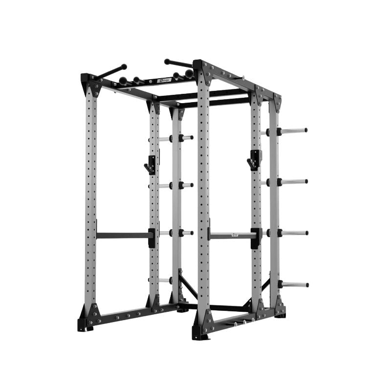 The Exigo E80 Elite Power Rack is a freestanding power rack with a grey metal frame, pull-up bars, safety bars, and plate storage—ideal commercial gym equipment for weightlifting and strength training.