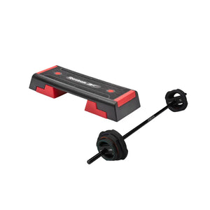 The Jordan Ignite Pump X™ Rubber Studio Set features a black studio barbell with textured grip and labeled round rubber plates, all in a sleek design, studio ready and shown isolated on a white background.