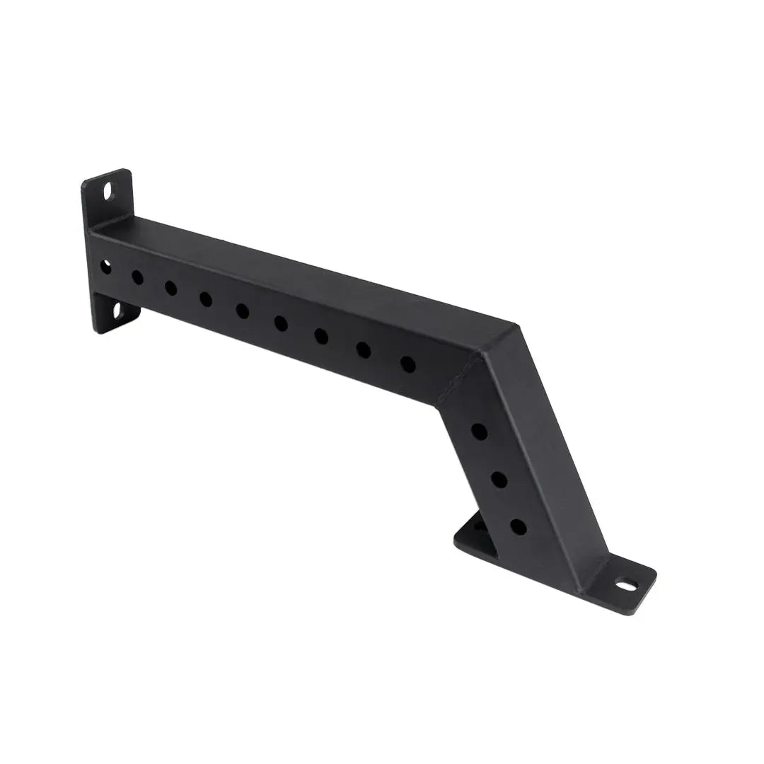 The Jordan Helix Fixed Power Rack Foot Attachments (pair) are black metal wall brackets with a Z-shape and multiple circular holes for mounting. These commercial-quality components are perfect for supporting shelves or racks, ensuring sturdy attachment in gym settings.