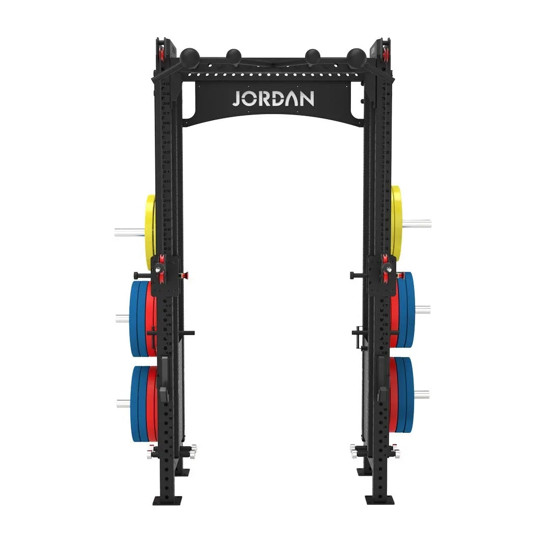 The JORDAN -J75 Cable Rack in black is a versatile gym power rack with barbells and weight plates on both sides. It features storage for weights and equipment, making it ideal for strength training exercises. The top arch is labeled Jordan.