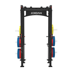 The JORDAN -J75 Cable Rack in black is a versatile gym power rack with barbells and weight plates on both sides. It features storage for weights and equipment, making it ideal for strength training exercises. The top arch is labeled Jordan.